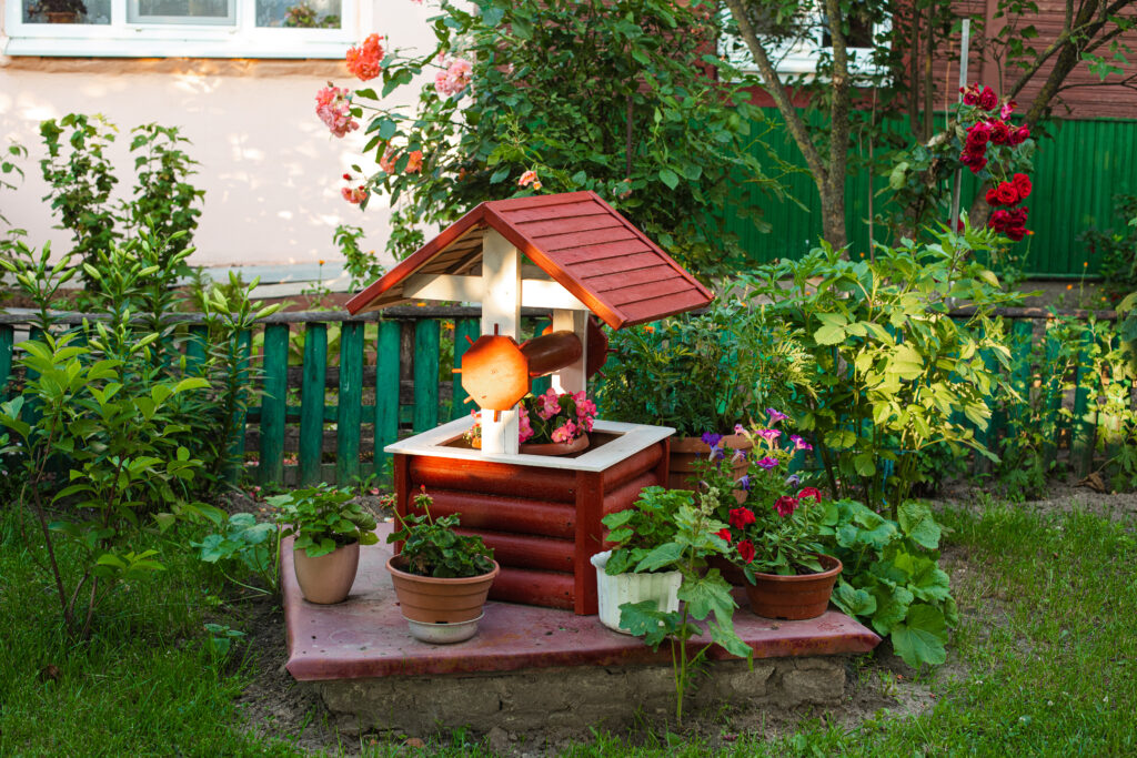 a nice backyard with an artificial well.